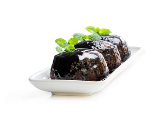 Sticky chocolate puddings isolated on white