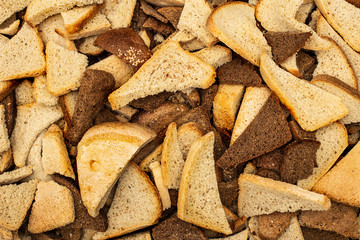 lots of pieces of wheat and rye bread close-up texture