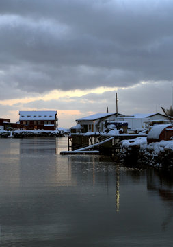 Traditional village houses covered with snow on the waterfront of the Lofoten islands-Norway.