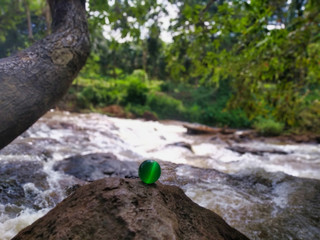 Green ball on the stone before River, Ratanakiri Cambodia