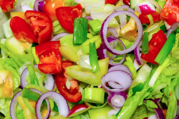 mix of vegetables chopped tomatoes lettuce red onion rings closeup background culinary colorful menu design