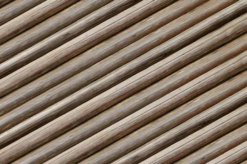 parallel ribbed background thin logs inclined base rustic gray beige background weathered old wood