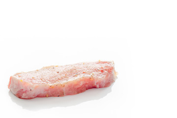 Raw pork meat on a white background