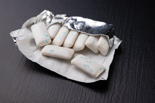 Chewing Gum On The Table. Mint Refreshing Tablet In A Silver Package.