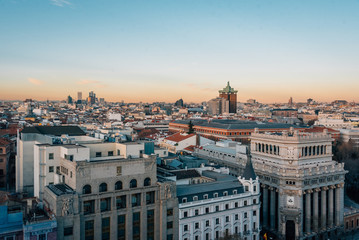 View of buildings along Gran Via from the Circulo de Bellas Artes rooftop at night, in Madrid, Spain