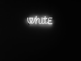 white neon sign on black background