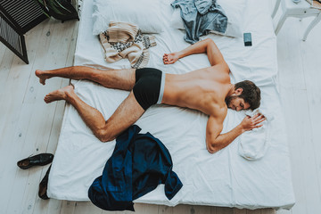 Naklejka premium Tired guy being in deep sleep after hard day