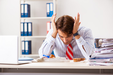 Man having meal at work during break