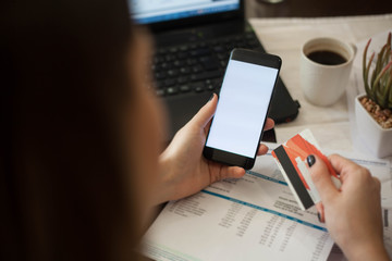 Online shopping mobile phone and credit card.