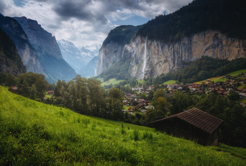 Gloomy view of alpine village. Location place Swiss alps, Lauterbrunnen valley.