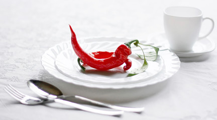 Red chilli on a white plate. Spicy Healthy Diet Fitness Food