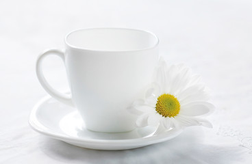 White cup for tea. Clean dishes symbol of purity