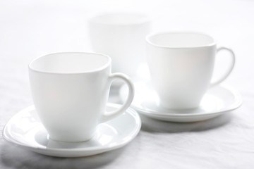 White cup for tea. Clean dishes symbol of purity