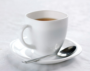 White cup with black tea. Good start to the day