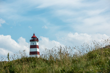 Fototapeta na wymiar Leuchtturm von Alnes auf der Insel Godøya bei Ålesund