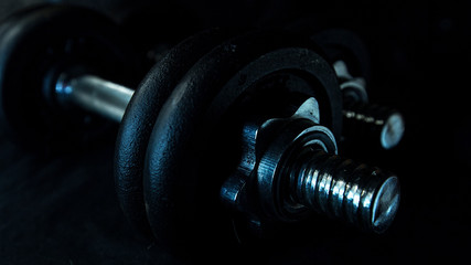Iron dumbbells. Large on a black background