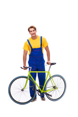 Obraz premium Man repairing his bike isolated on white background