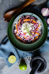 Coleslaw salad with red and white cabbage, red onion, carrot and sour cream