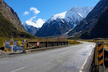 View of bridge and mountains from Monkey Creek, Fjordland, South Island, New Zealand. State Highway 94.