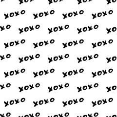 Seamless pattern XOXO on white background. Grunge hand written brush lettering XO. Hugs and kisses abbreviation symbol. Easy to edit template for Valentine’s day. Vector illustration.