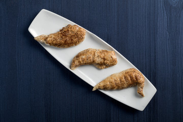 Traditional Spanish tapas dish. BBQ chicken, top view. Copyspace