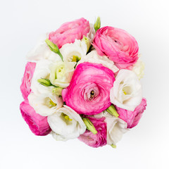 Ranunculus and lisiathus floral bouquet flat lay on white background
