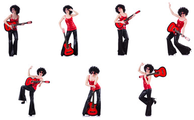 Woman in afro wig playing guitar 
