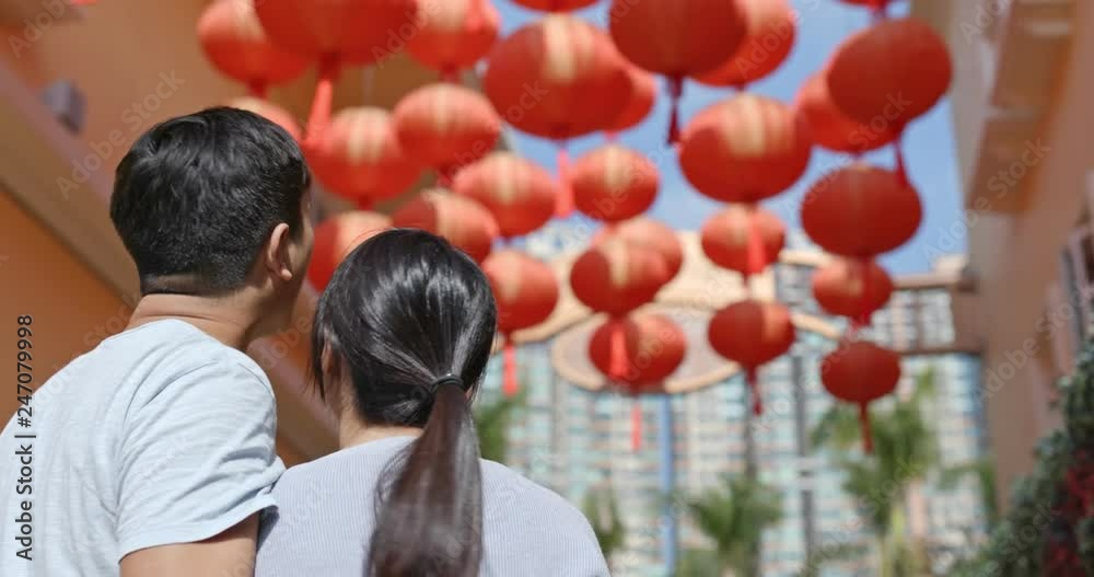 Sticker couple enjoy look at the red lantern in the street