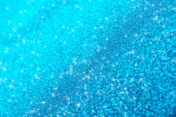 Fototapeta na wymiar Bright beautiful shining blue glitter as background