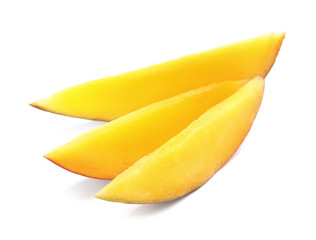 Fototapeta na wymiar Slices of delicious ripe mango on white background