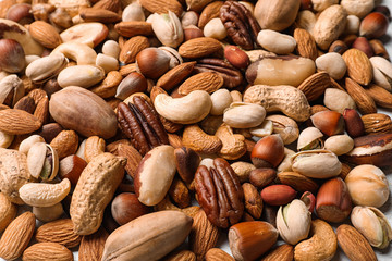 Organic mixed nuts as background, closeup. Healthy snack