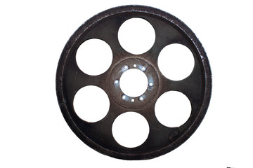 An old ferrous wheel is covered by a blight..