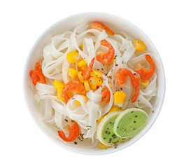 Bowl with rice noodles, shrimps and vegetables on white background, top view