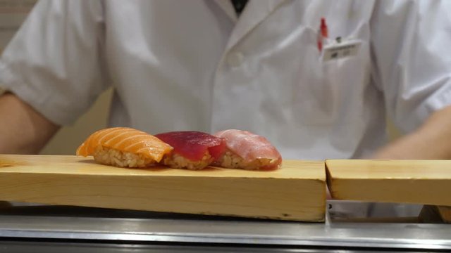 Skilled Japanese chef prepare Edomae-sushi (sushi shaped by hand) at the restaurant, filmed in 4K