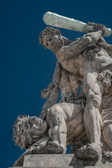 Obraz premium Sculpture of wrestling Titans or fighting Giants at the main gate to courtyard of Prague Castle, Prague, Czech Republic, summer time