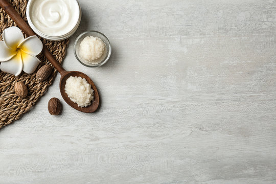 Flat Lay Composition With Shea Butter, Nuts And Space For Text On Light Background