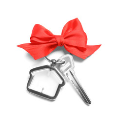 Naklejka premium House key with trinket and bow on white background