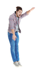 Young man attracted to magnet on white background