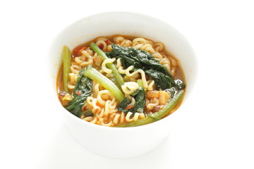 Korean spicy instant ramen with green leaf vegetable