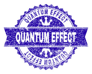 QUANTUM EFFECT rosette stamp imitation with distress texture. Designed with round rosette, ribbon and small crowns. Blue vector rubber watermark of QUANTUM EFFECT title with scratched texture.