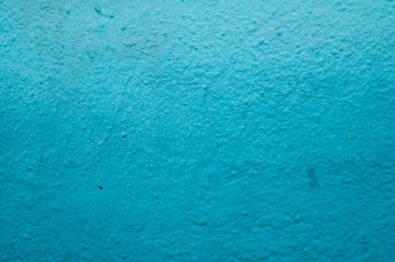 closeup of blue graffiti on the wall texture