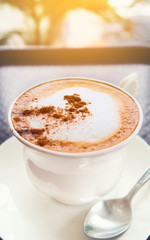 Cappuccino coffee foam with morning sunshine, fresh and ready start up