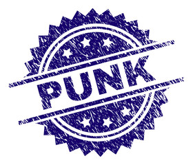 PUNK stamp seal watermark with distress style. Blue vector rubber print of PUNK text with scratched texture.