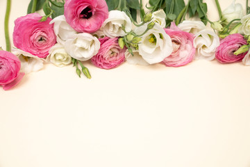 Pink and White floral border on cream color backgrounf flat lay