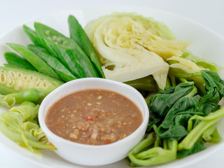 Thai cuisine nam prik or chili paste with various vegetables or with blanched vegetables, Thai Traditional Local Food on white background