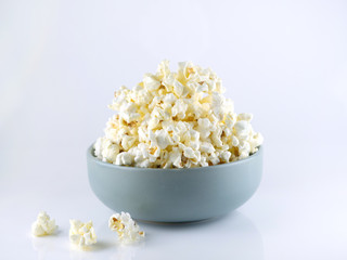 Popcorn in bowl isolated on white background
