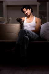Fototapeta premium Young man suffering at home night time 
