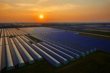Fototapeta na wymiar Aerial photography, solar photovoltaic panels for greenhouses on the roof of greenhouses