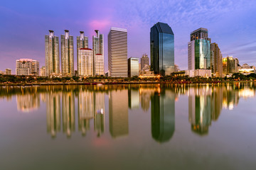 Office building central business downtown with water reflection, cityscape background