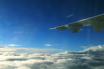 Fototapeta premium Airplane wing in the air. Flying wing, airplane wing in the skyAirplane wing in the air. Flying wing, airplane wing in the sky